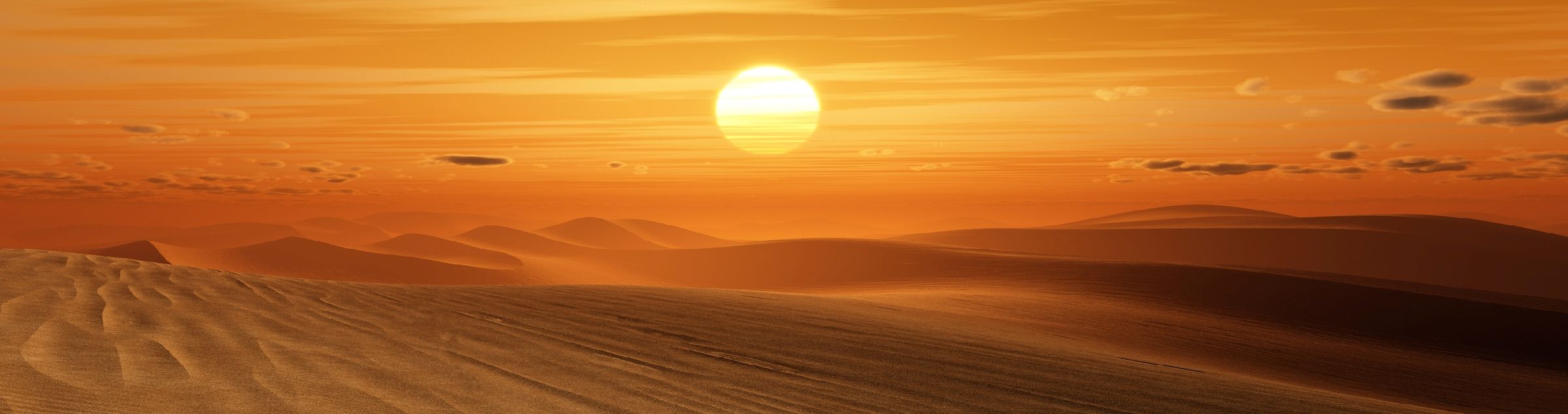 Eine Wüste im roten Licht des Sonnenuntergangs